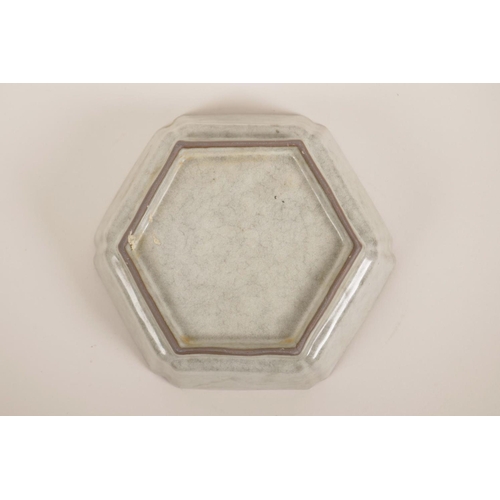 55 - A Chinese celadon glazed hexagonal pottery dish, 6½