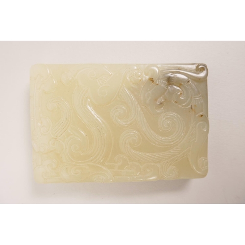 110 - A Chinese white jade tablet pendant with carved dragon and phoenix decoration to both sides, 2