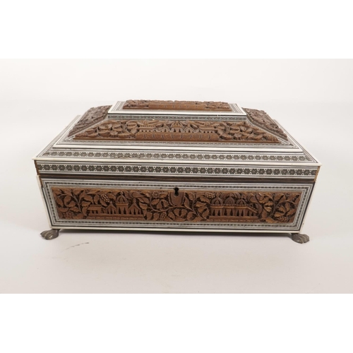 121 - A C19th Vizagapatan workbox and content with carved decoration of temples, A/F losses to micromosaic... 