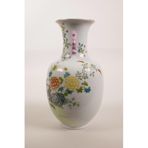 123 - A Chinese polychrome porcelain vase with two handles and enamel decoration of deer and chrysanthemum... 