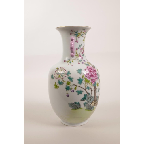 123 - A Chinese polychrome porcelain vase with two handles and enamel decoration of deer and chrysanthemum... 