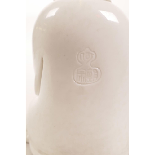 126 - A Chinese blanc de chine figure of Quan Yin, impressed mark verso, 5