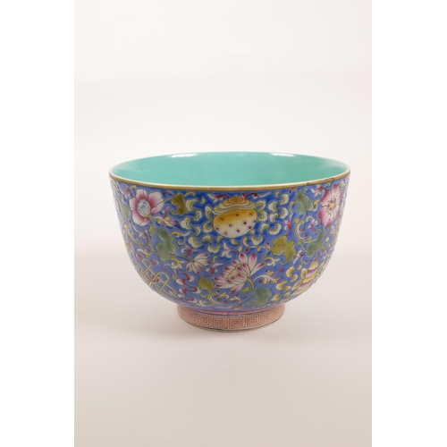 128 - A Chinese polychrome porcelain rice bowl decorated with flowers and the Eight Buddhist Treasures, 4 ... 