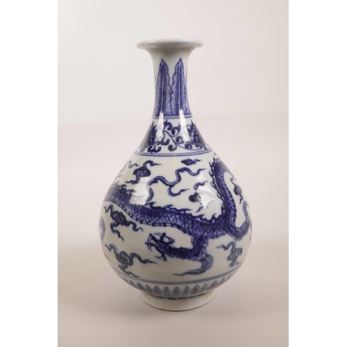 138 - A Chinese blue and white porcelain pear shaped vase decorated with a dragon chasing the flaming pear... 