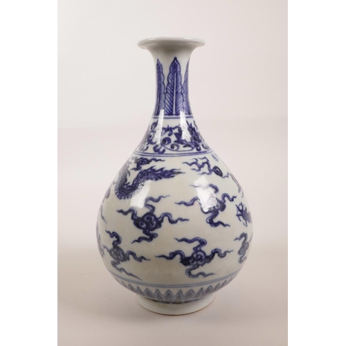 138 - A Chinese blue and white porcelain pear shaped vase decorated with a dragon chasing the flaming pear... 