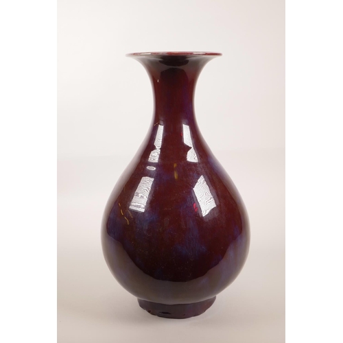 143 - A large Chinese flambé glazed pottery vase, 13½