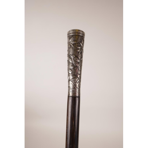 15 - A Chinese bamboo swagger stick with a white metal mount decorated with birds and insects, 32