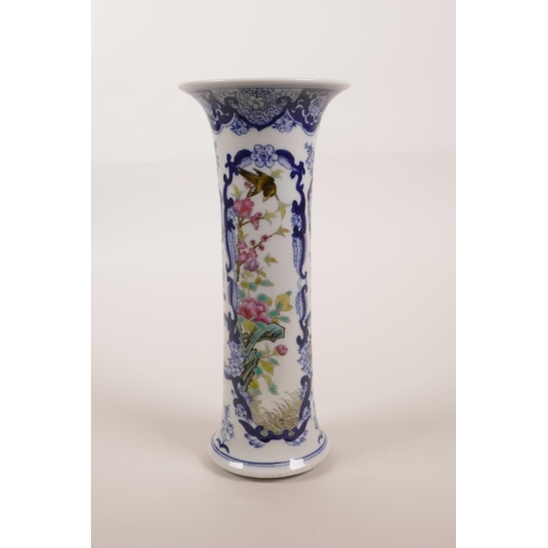 16 - A Chinese blue and white gu shaped vase with polychrome enamel decoration of birds amongst prunus bl... 