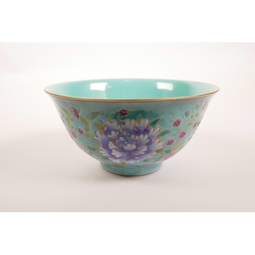 178 - A Chinese polychrome porcelain rice bowl decorated with bright flowers on a blue ground, seal mark t... 