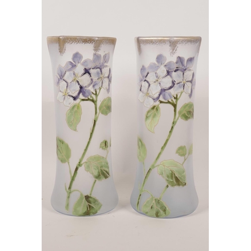 19 - A pair of French enamelled opaline glass vases, with  painted flower decoration and gilt rims, 9