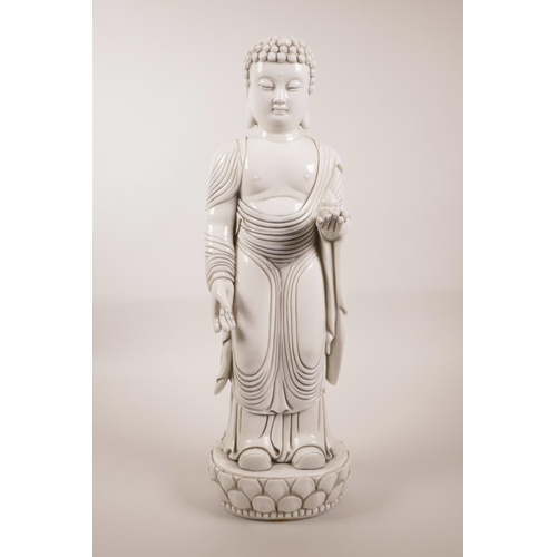 3 - A large Chinese blanc de chine figure of Buddha on a lotus flower, impressed marks verso, 17½