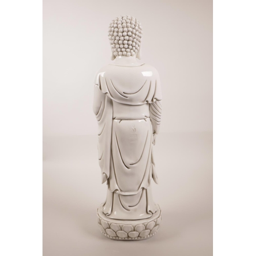 3 - A large Chinese blanc de chine figure of Buddha on a lotus flower, impressed marks verso, 17½