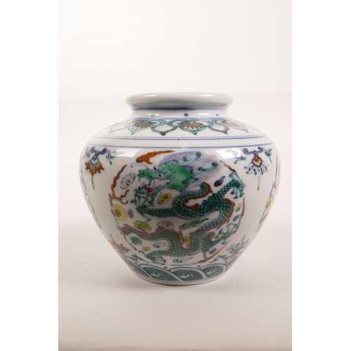 30 - A Chinese doucai porcelain jar decorated with a dragon chasing the flaming pearl, 6 character mark t... 