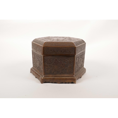 348 - A Chinese copper hexagonal box decorated with a stamped lotus flower pattern, 5½