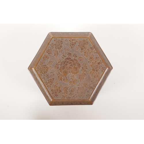 348 - A Chinese copper hexagonal box decorated with a stamped lotus flower pattern, 5½