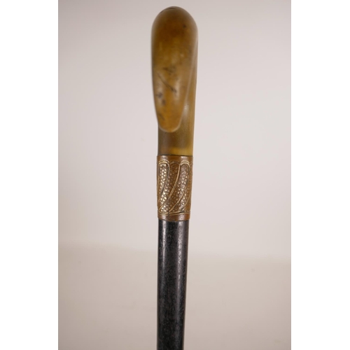 349 - A horn handled and ebonised wood walking stick with a gilt copper mount, handle possibly rhino horn,... 