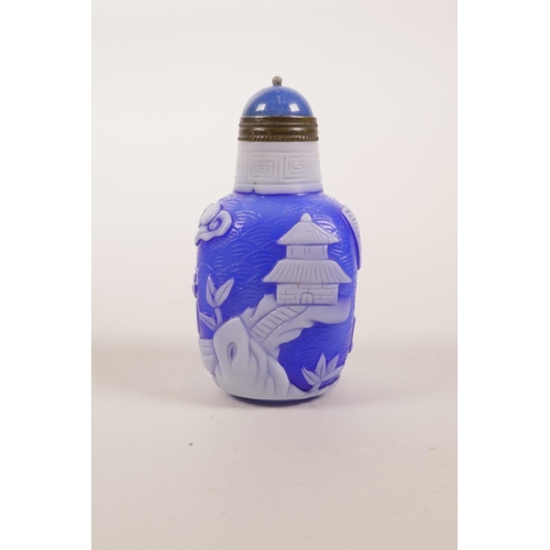 36 - A Chinese blue and white Peking glass snuff bottle decorated with figures in a landscape scene, 3