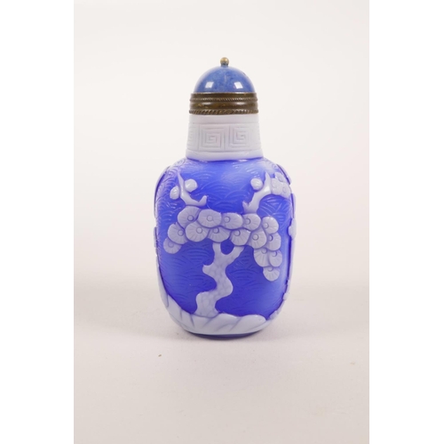 36 - A Chinese blue and white Peking glass snuff bottle decorated with figures in a landscape scene, 3