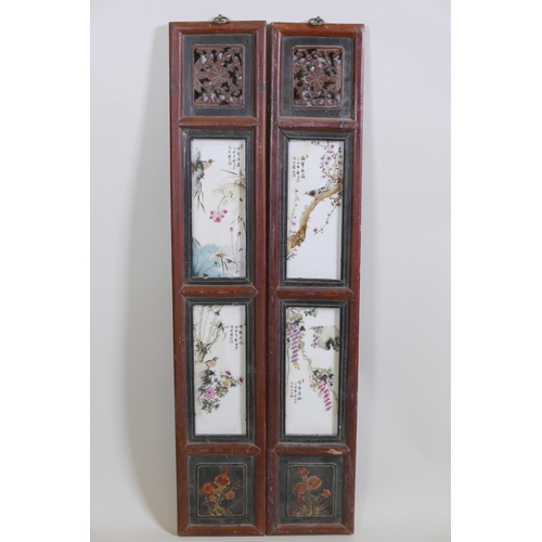 47 - A pair of Chinese polychrome porcelain panels set with four plaques depicting birds amongst bamboo, ... 