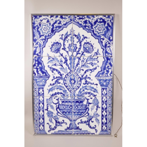 49 - An Eastern blue and white six tile panel depicting an urn with flowers, 16