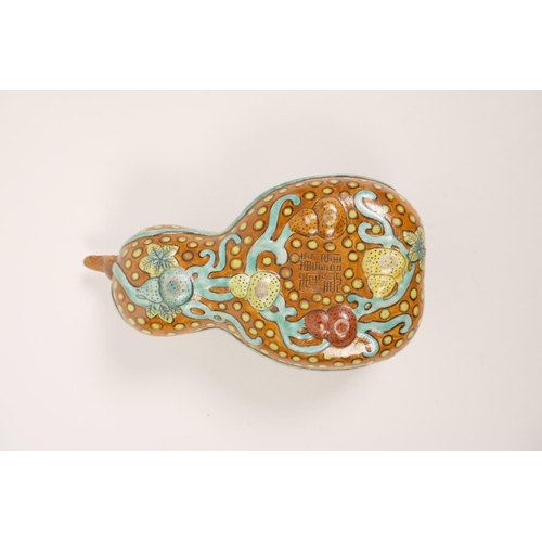 50 - An unusual Chinese polychrome pottery trinket dish in the form of a double gourd, impressed seal mar... 