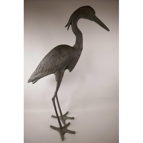 61 - A large metal garden figure of a heron, 34