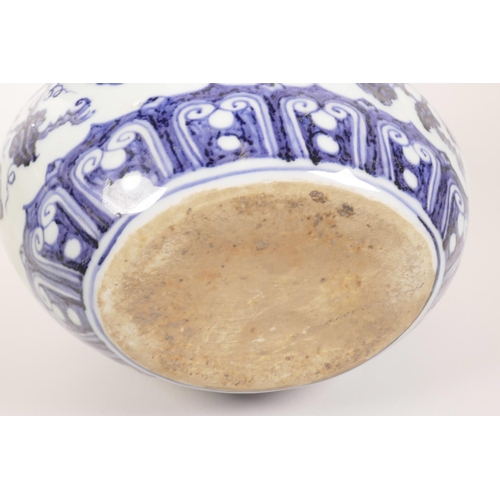 63 - A Chinese blue and white two handled moon flask decorated with branches bearing fruit, 6 character m... 