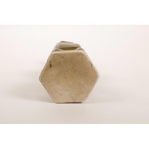 68 - A Chinese tea dust glazed pottery spill vase of hexagonal form with integrated stand, 7½