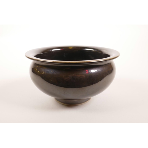 70 - A Chinese porcelain rice bowl with a deep brown mirror glaze, 6 character mark to base, 5½