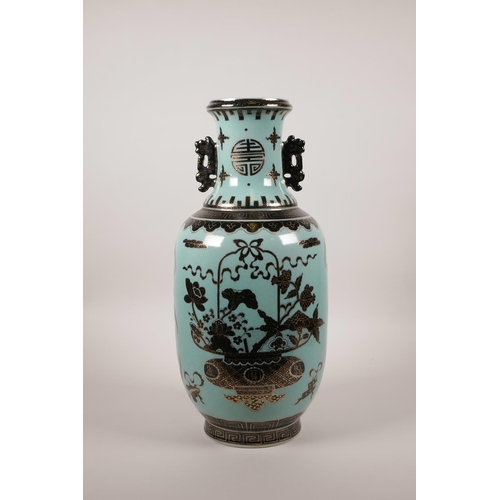 20 - A Chinese turquoise ground two handled porcelain vase with black and gilt decoration of vases of flo... 