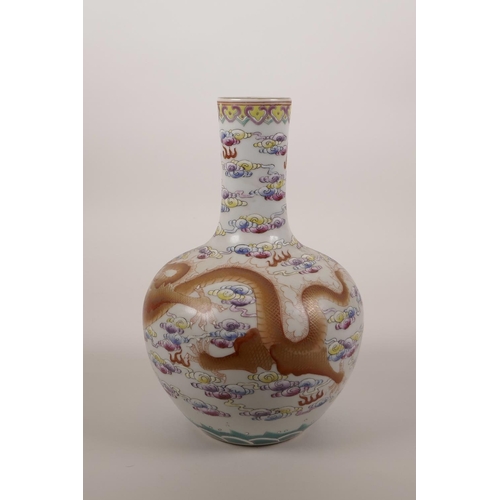 24 - A Chinese polychrome porcelain vase decorated with a red and gilt dragon chasing the flaming pearl, ... 