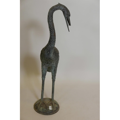 39 - A weathered bronze figure of a heron, 35