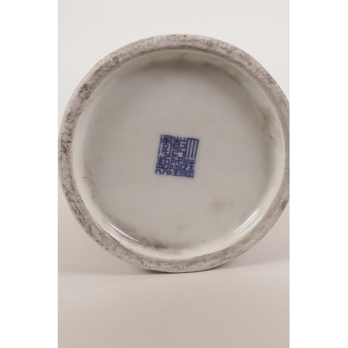 46 - A Chinese blue and white porcelain brush pot with decoration of a woman reading a book, seal mark to... 