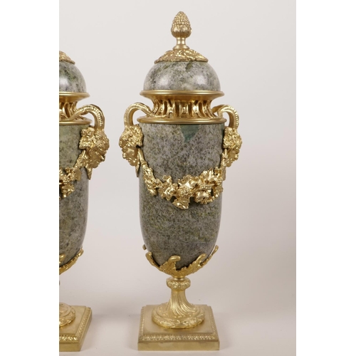 51 - A pair of ormolu mounted marble cassoulets decorated with vine swags and masks of the god Pan, 12½