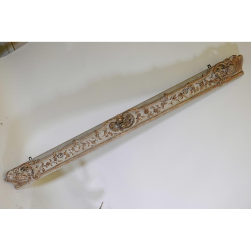 1106 - A C19th carved wood cornice section with painted and gilt decoration, 62