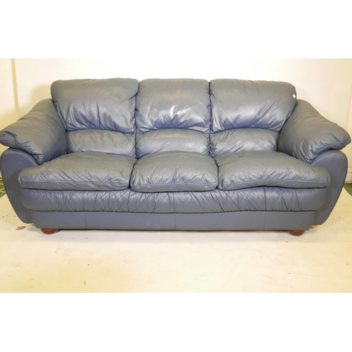 1108 - A blue leather three seater sofa, 84