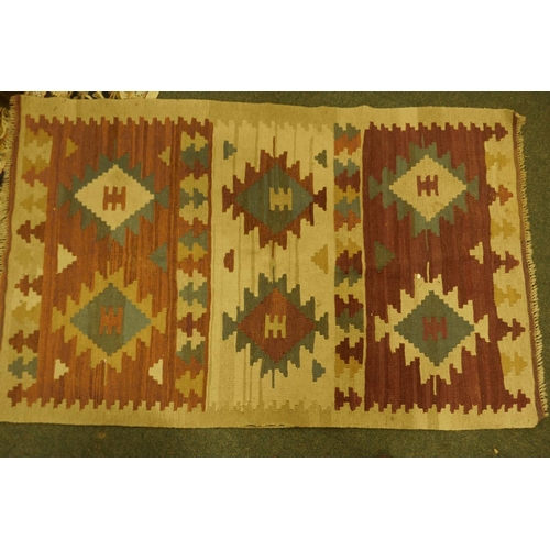 1113 - An Eastern kilim rug decorated with geometric patterns, 62