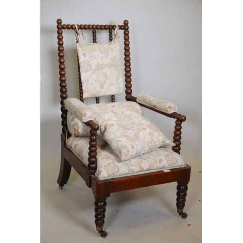 1115 - A William IV bobbin turned open elbow chair, with faux rosewood grained decoration