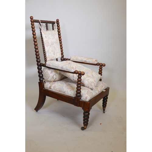 1115 - A William IV bobbin turned open elbow chair, with faux rosewood grained decoration