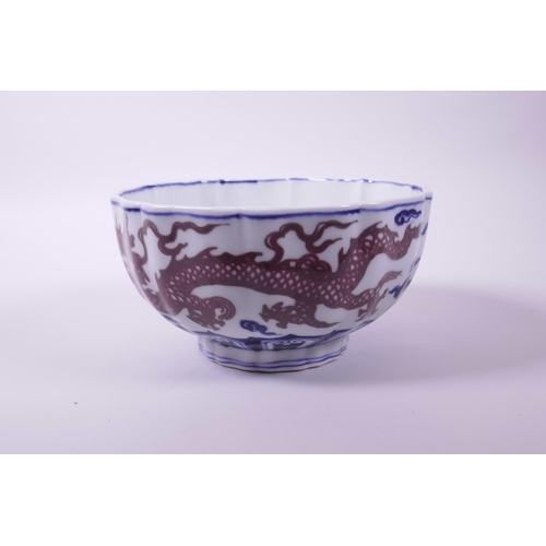 23 - A Chinese blue and white porcelain bowl with lobed rim and red dragon decoration, 6 character mark t... 