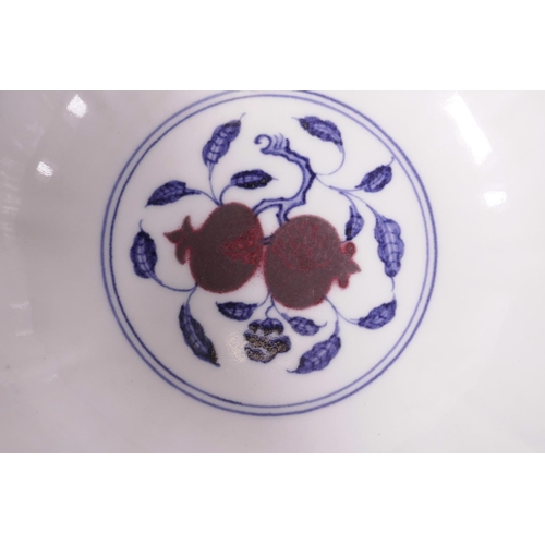 23 - A Chinese blue and white porcelain bowl with lobed rim and red dragon decoration, 6 character mark t... 