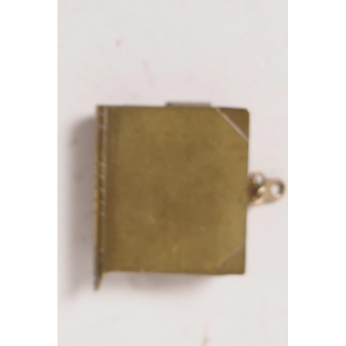 28 - A brass bound miniature book containing photographs of female nudes taken from classical paintings, ... 