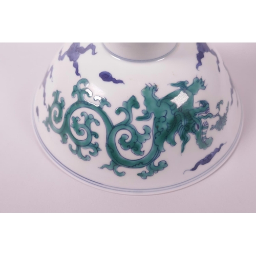 33 - A Chinese blue and white porcelain stem bowl with green enamelled dragon decoration, 6 character mar... 