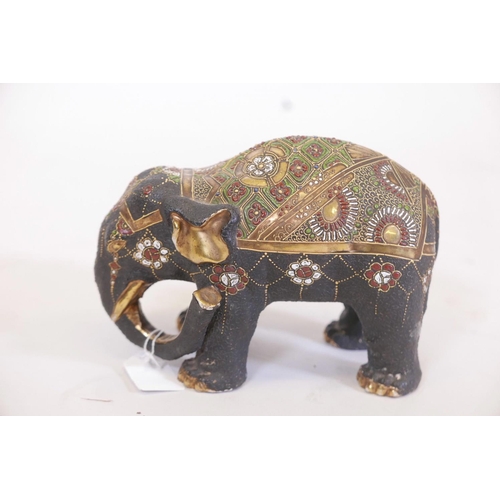 34 - A Satsuma porcelain figure of an elephant, with enamel and gilt highlights, 8