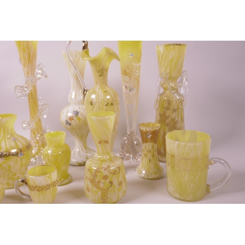 35 - A collection of decorative yellow glass vases, many with enamelled decoration in the Beykoz manner, ... 