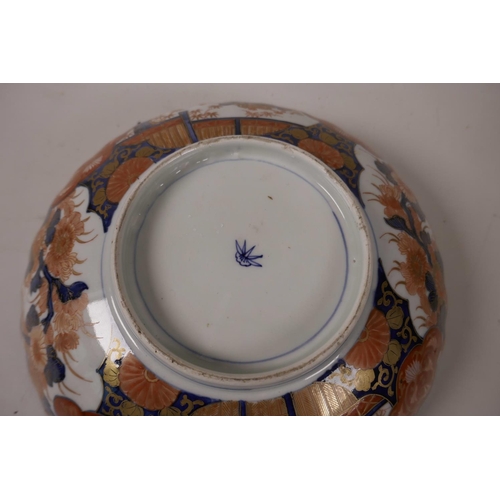 4 - A C19th Imari porcelain bowl with frilled rim decorated in the tradititional palette, 11½