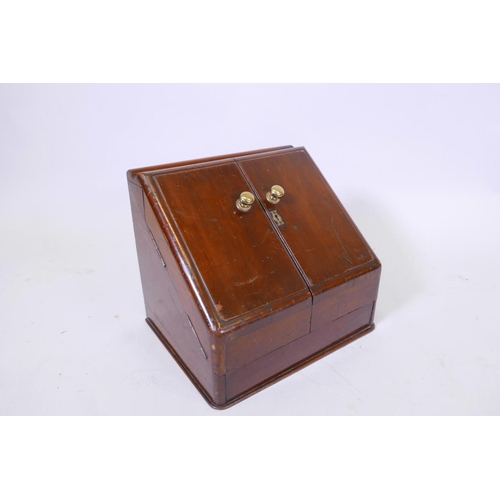 42 - A Victorian mahogany stationery cabinet, with two doors opening to reveal a fitted interior, the top... 