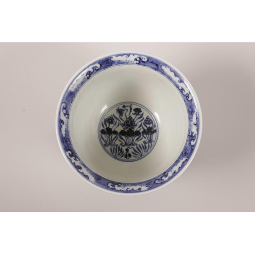 43 - A Chinese blue and white porcelain steep sided bowl decorated with carp in a lotus pond, 4