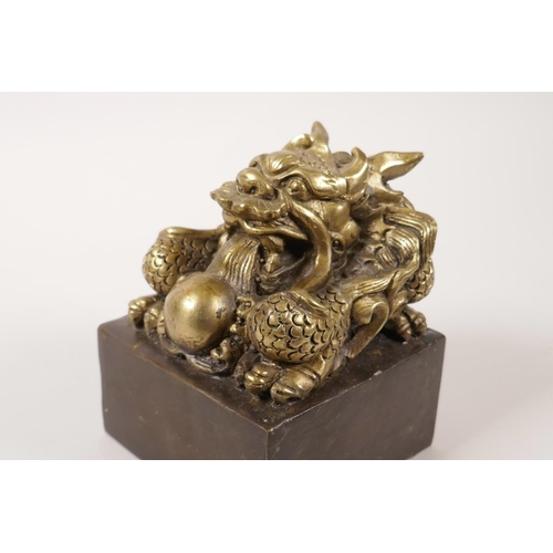 58 - A large Chinese filled bronze seal with a dragon knop, 4