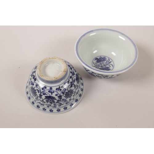 63 - A pair of Chinese blue and white porcelain tea bowls with scrolling lotus flower decoration, 4 chara... 